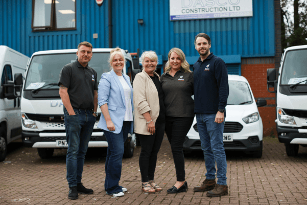 Wigan Business Expo organisers with the DASCO Construction team outside their Wigan premises and branded vehicles.